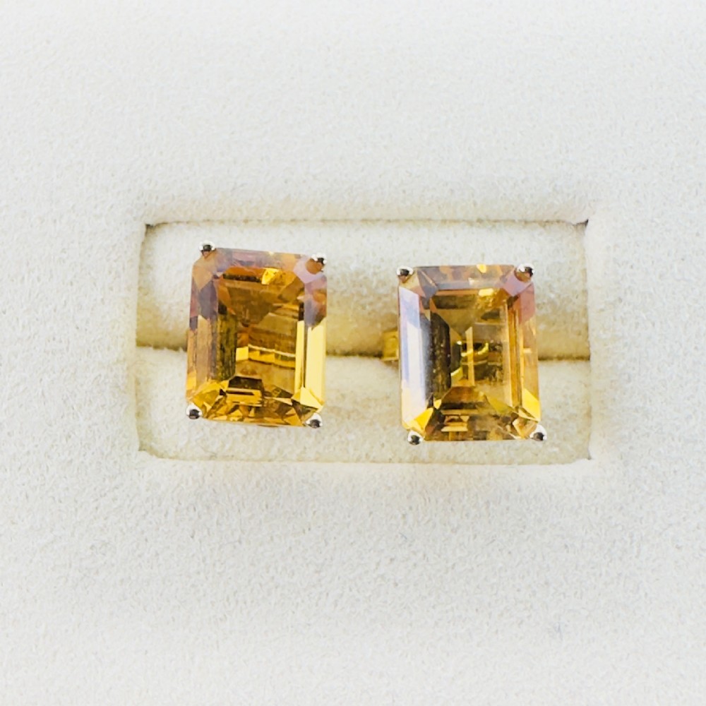 A pair of 14ct gold Art Deco stud earrings, each featuring a claw-set, emerald-cut golden yellow citrine gemstone. View II