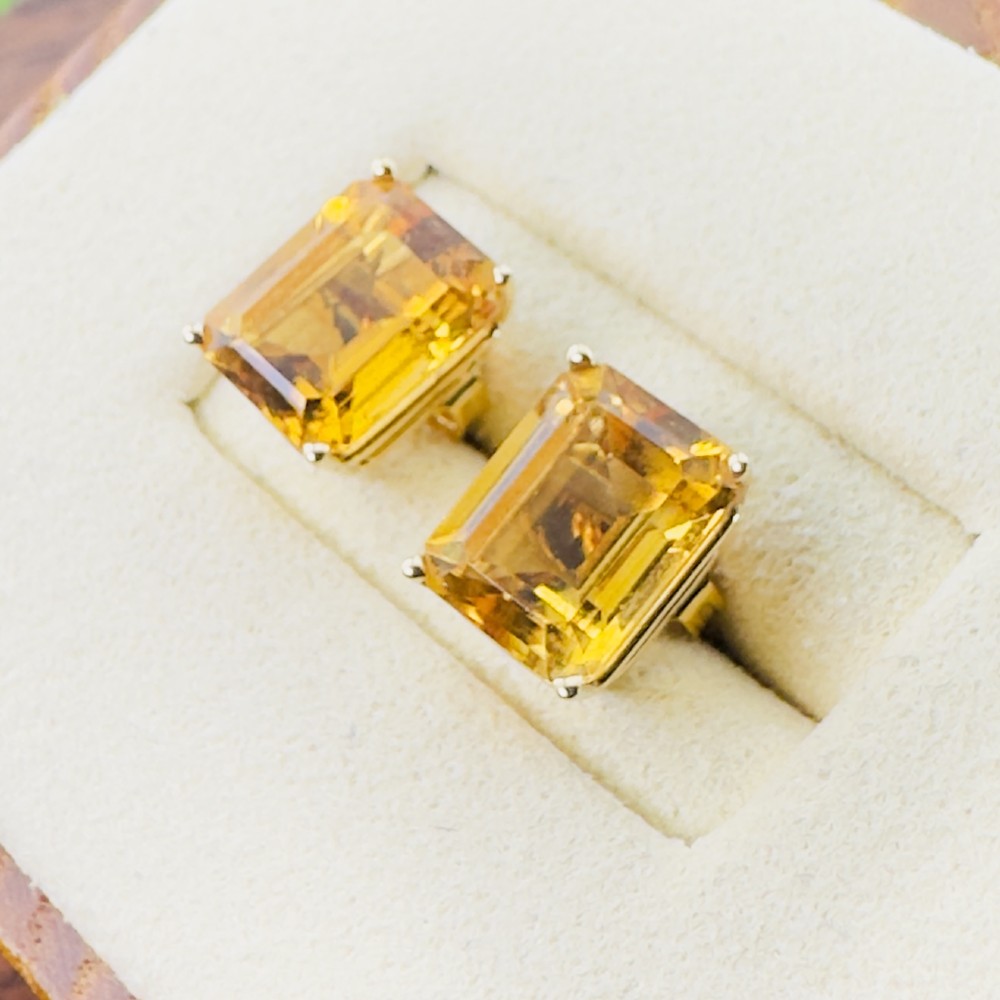 A pair of 14ct gold Art Deco stud earrings, each featuring a claw-set, emerald-cut golden yellow citrine gemstone. View III
