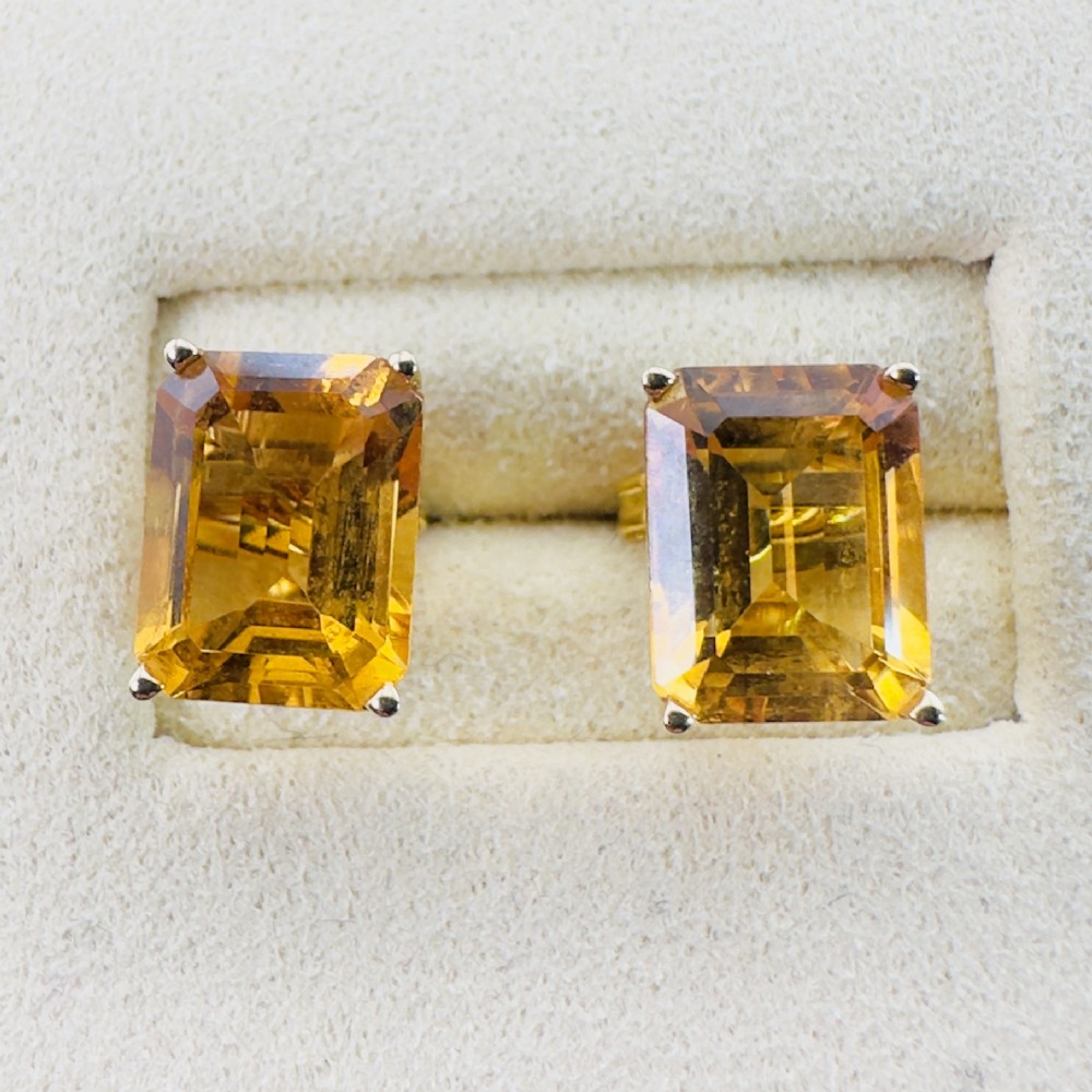A pair of 14ct gold Art Deco stud earrings, each featuring a claw-set, emerald-cut golden yellow citrine gemstone. View IV