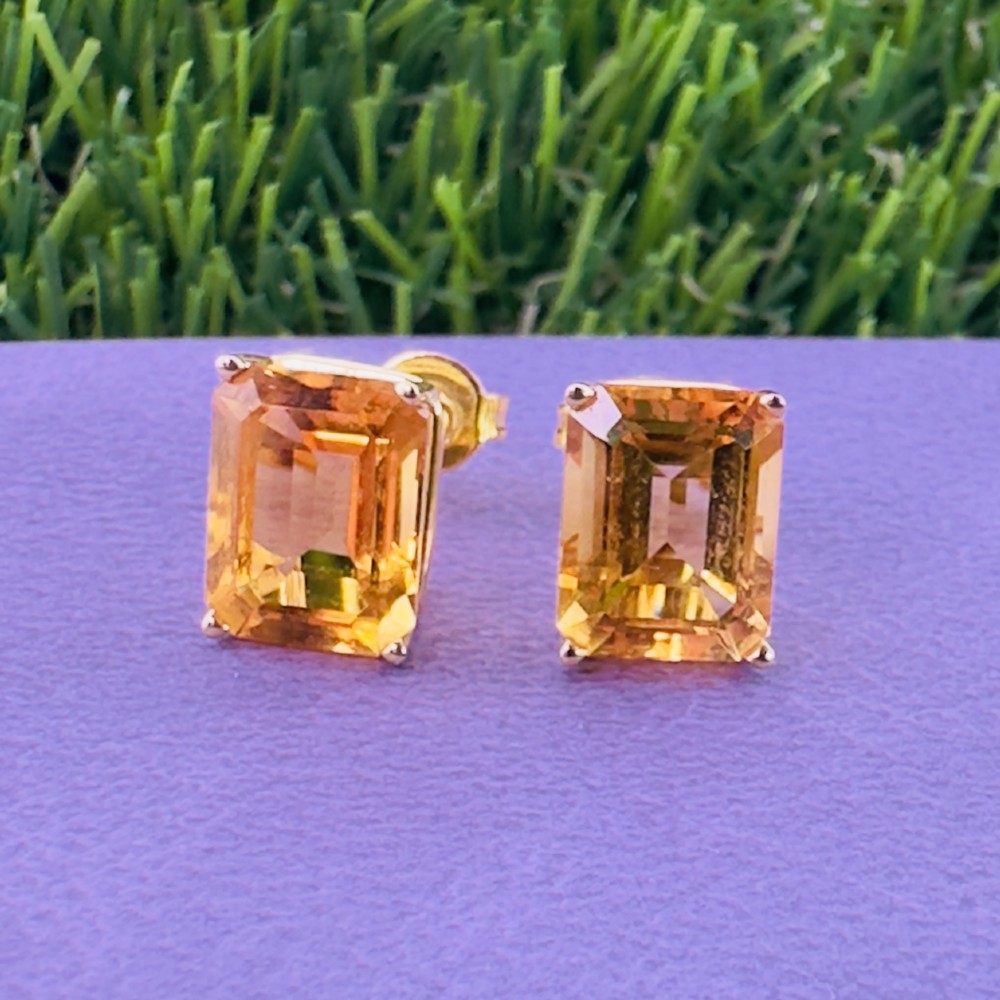 A pair of 14ct gold Art Deco stud earrings, each featuring a claw-set, emerald-cut golden yellow citrine gemstone. View V