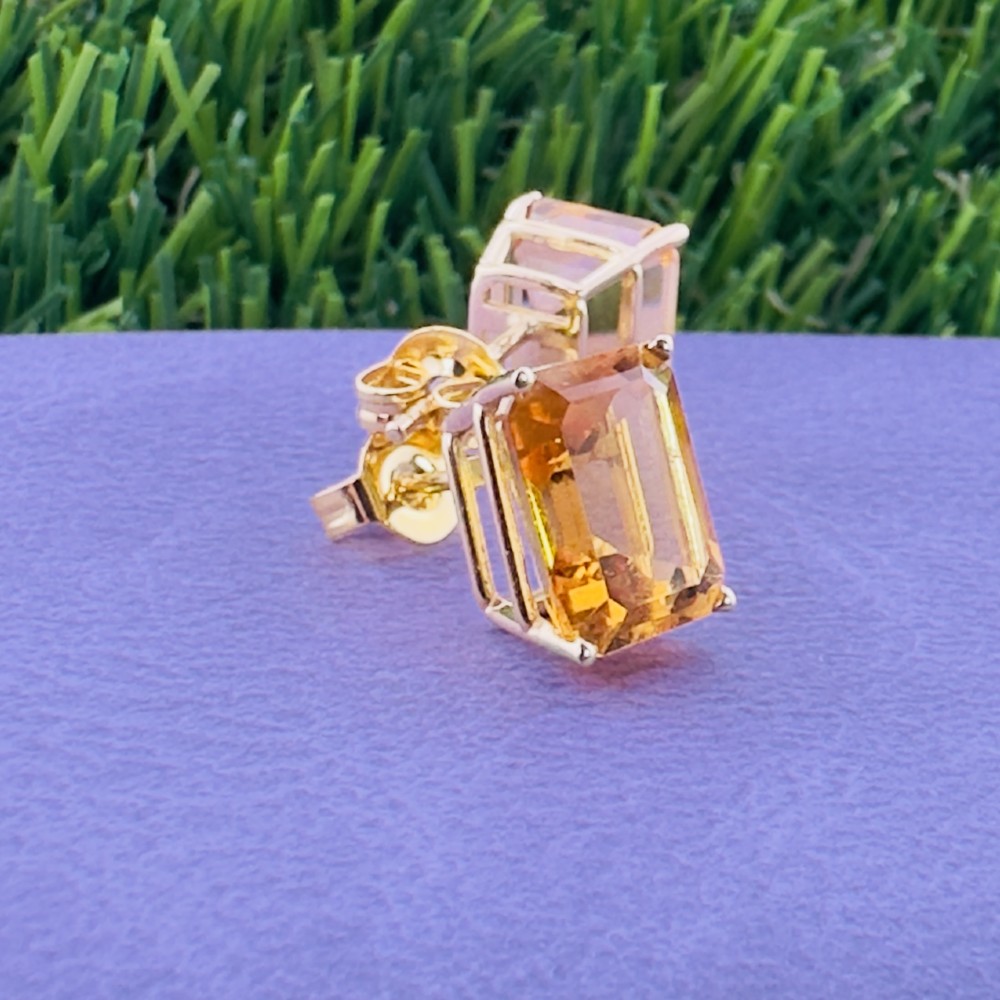 A pair of 14ct gold Art Deco stud earrings, each featuring a claw-set, emerald-cut golden yellow citrine gemstone. View VII