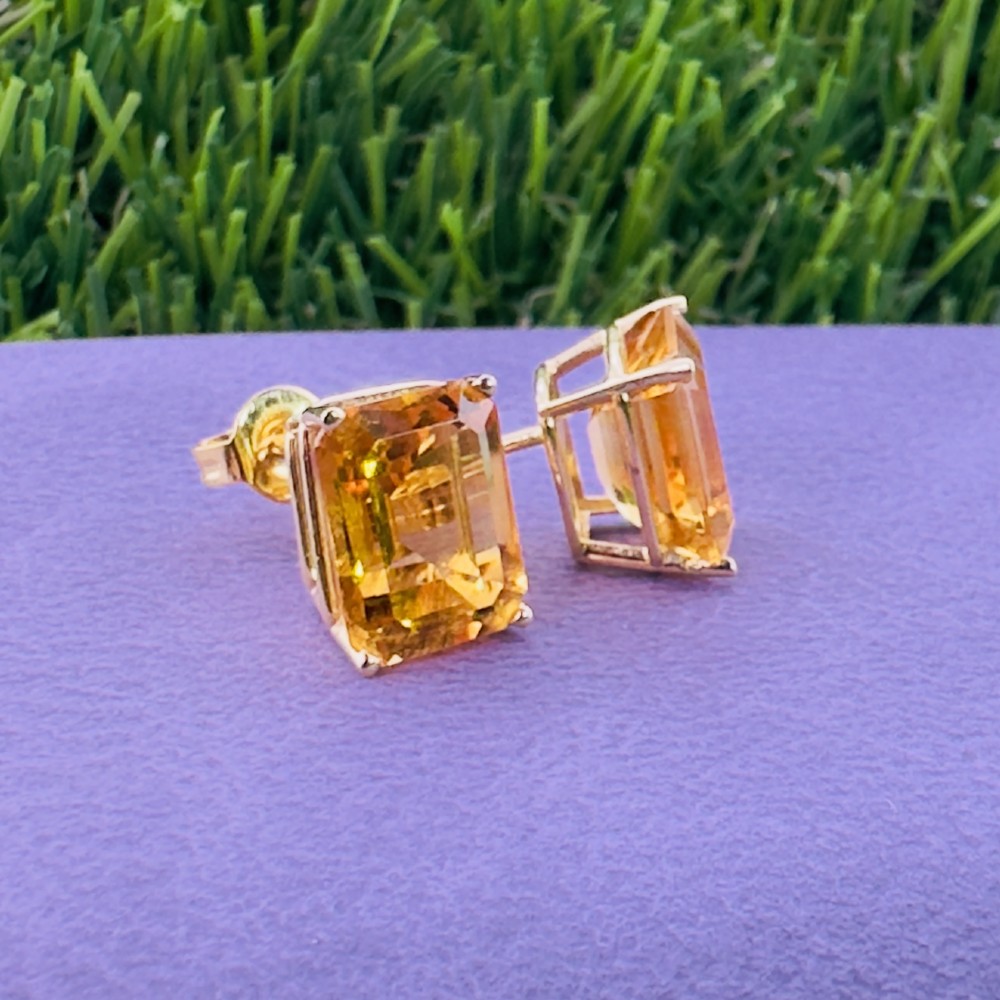 A pair of 14ct gold Art Deco stud earrings, each featuring a claw-set, emerald-cut golden yellow citrine gemstone. View VIII