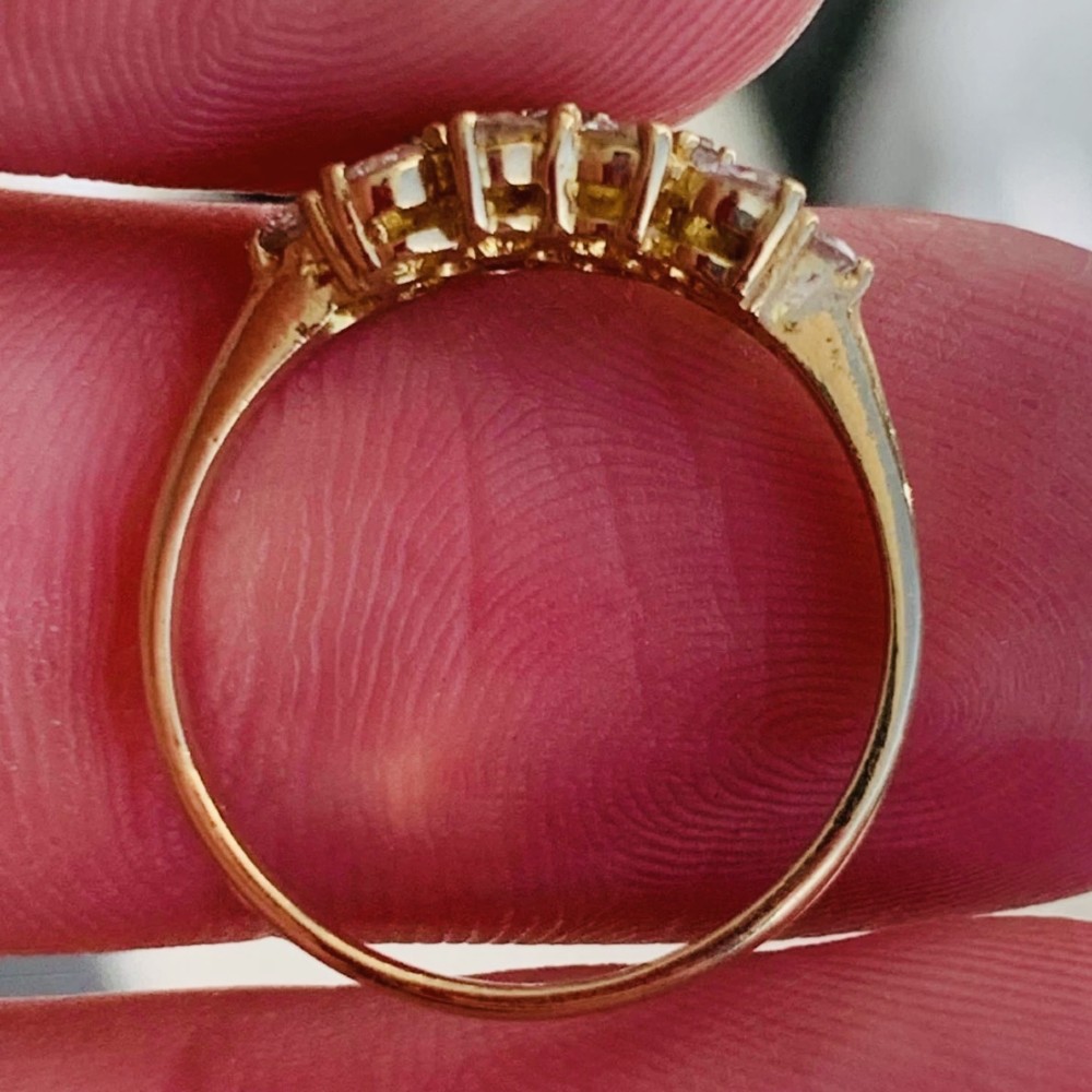 An 18ct yellow gold Art Deco cluster ring set with ten old European cut diamonds arranged in a contoured multi-row setting. View V