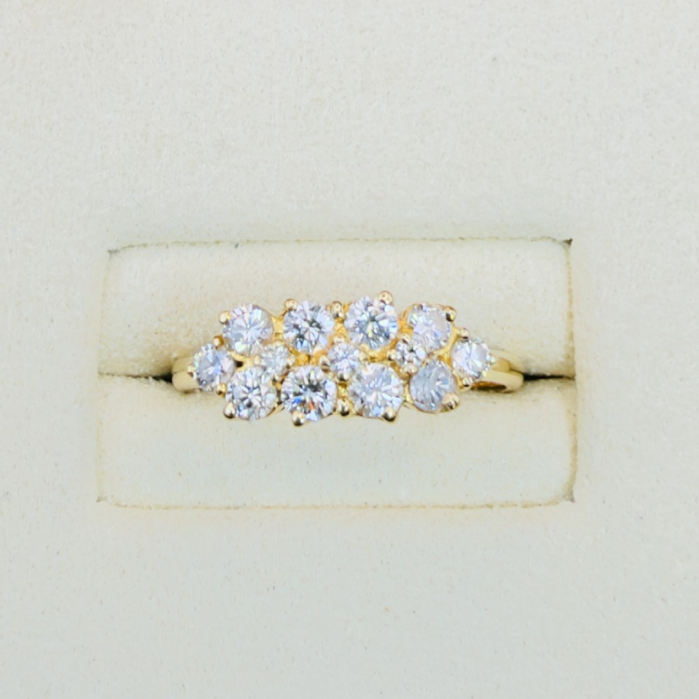 An 18ct yellow gold Art Deco cluster ring set with ten old European cut diamonds arranged in a contoured multi-row setting. View VI