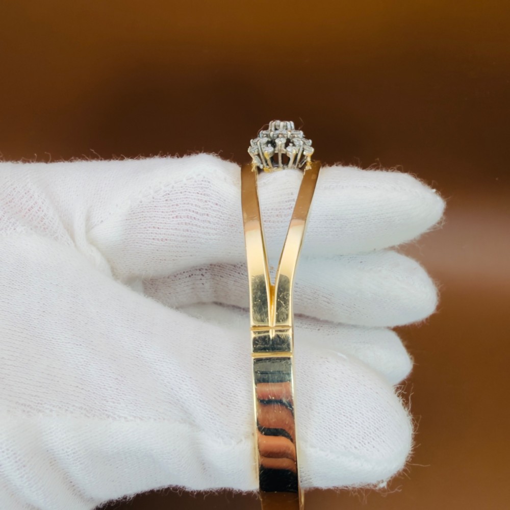 A solid 9ct yellow gold split-band cuff bangle featuring a central multi-stone diamond cluster set in a tiered round formation. View XIII