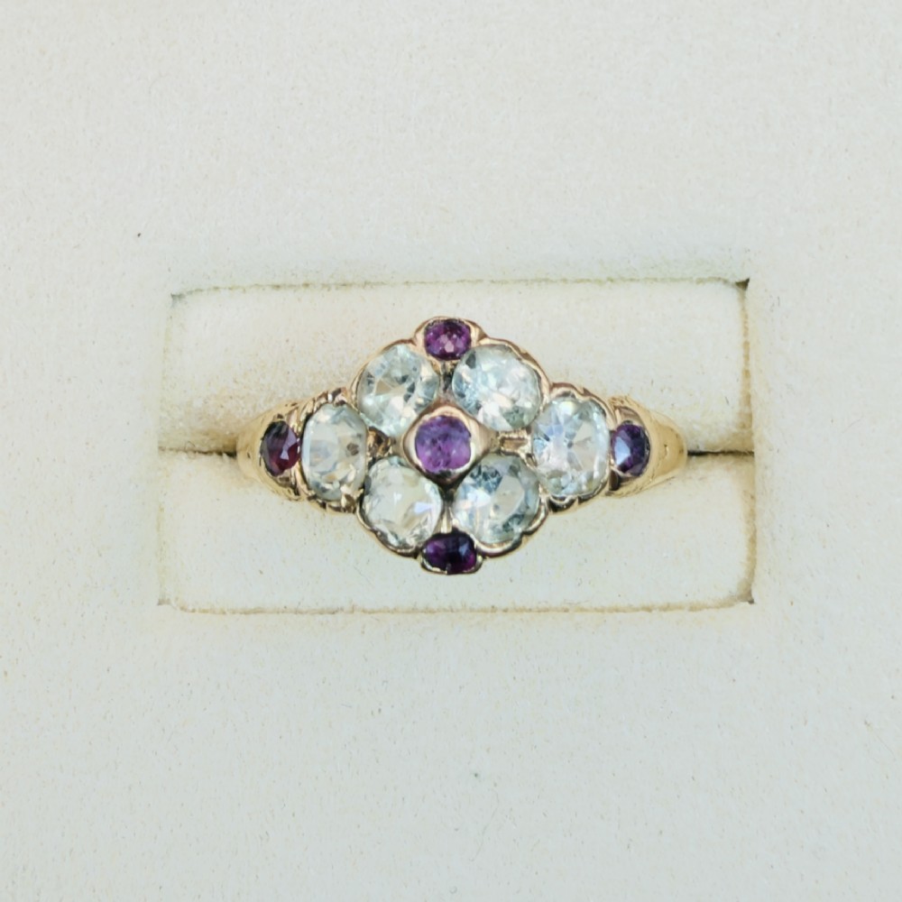 An 18ct yellow gold early Victorian cluster ring set with pale green spinels, rubies, and purple almandine garnets. View II