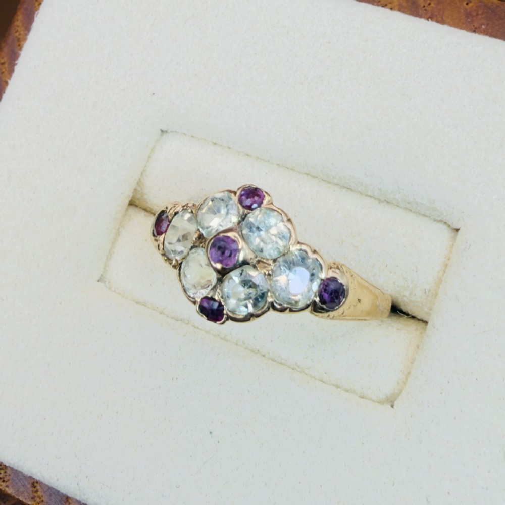 An 18ct yellow gold early Victorian cluster ring set with pale green spinels, rubies, and purple almandine garnets. View III