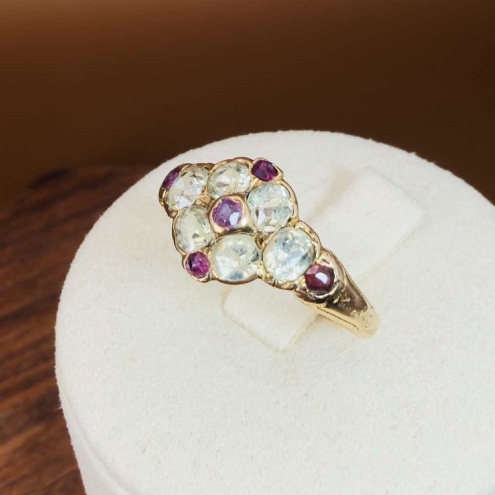 An 18ct yellow gold early Victorian cluster ring set with pale green spinels, rubies, and purple almandine garnets. View XI