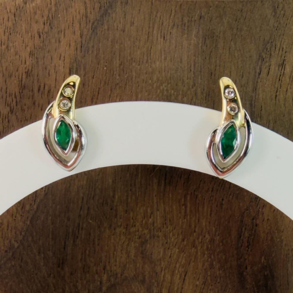 A pair of two-tone 14ct gold stud earrings set with marquise-cut green emeralds and small round diamonds. View II