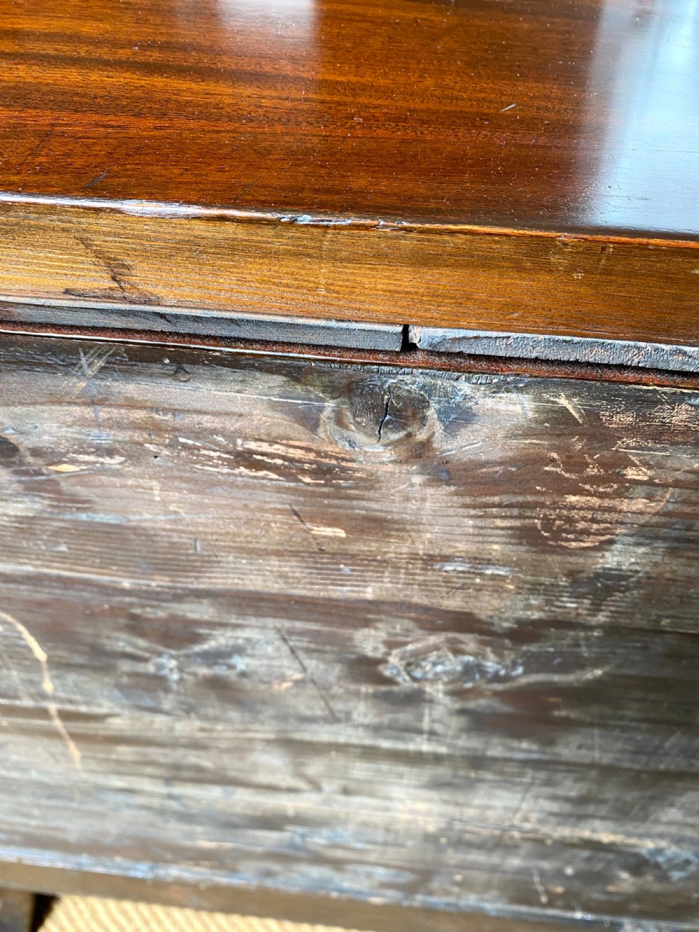 An Irish George III mahogany chest on a stand featuring a brass escutcheon, shaped apron, and carved cabriole legs. View IX