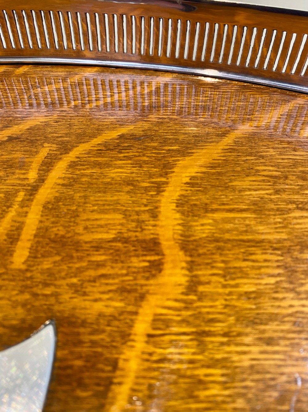An oval 19th-century quarter-sawn oak gallery tray featuring a pierced silver-plated rim, central engraved shield plaque, and side carrying handles. View XI