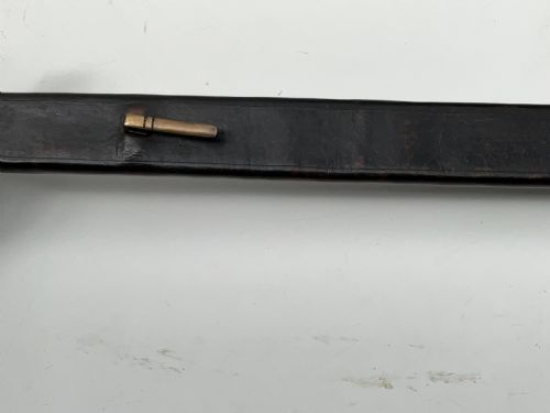 fig 2. A British 1804 pattern naval boarding cutlass featuring a black figure-eight iron handguard and a straight single-edged steel blade.