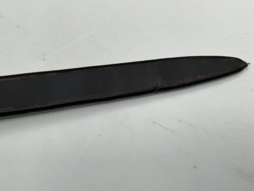 fig 3. A British 1804 pattern naval boarding cutlass featuring a black figure-eight iron handguard and a straight single-edged steel blade.