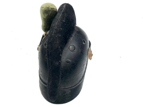 fig 2. An antique black leather Imperial German military helmet featuring a crowned monogram brass plate, lion head side bosses, and a dense black and green woolen crest.
