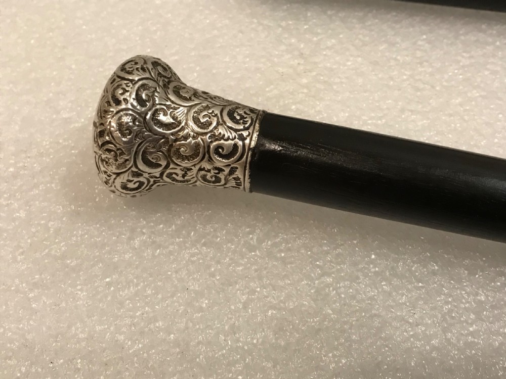 Gentleman’s walking stick sword stick ebony & Silver top hallmarked for Birmingham 1918 View XI