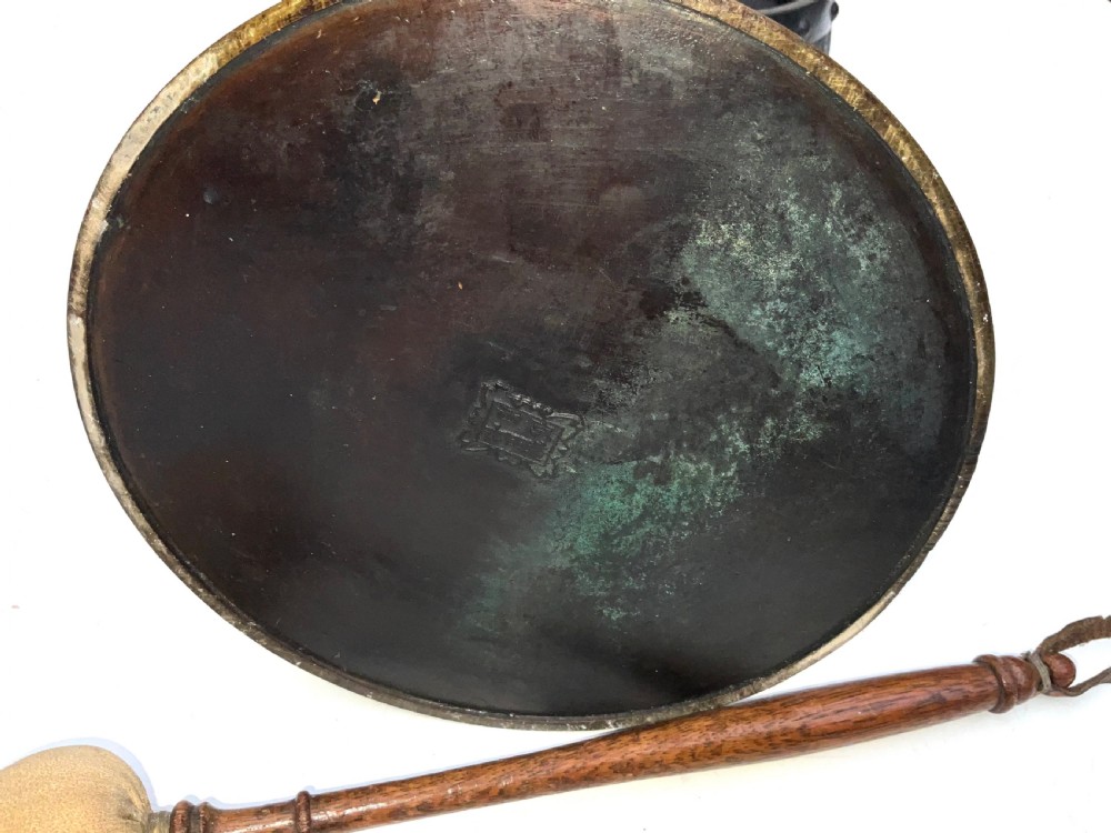 A Victorian dark bronze tabletop dinner gong featuring relief carving and a sculpted figure mounted atop a circular pedestal base. View XIII