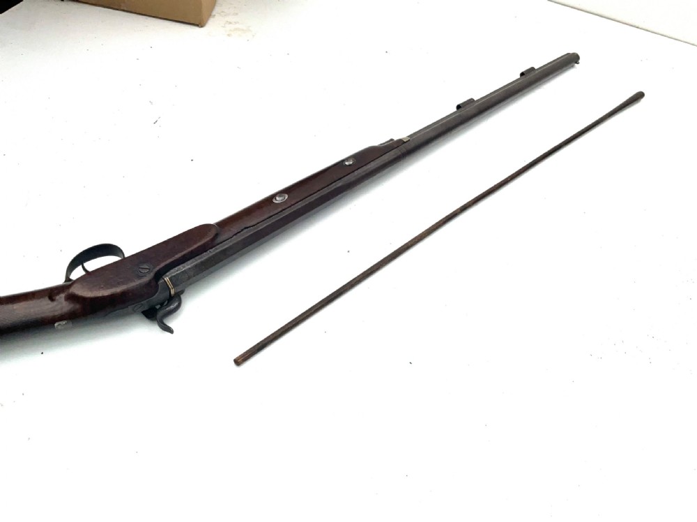An antique nineteenth-century single-barrel percussion fowler featuring a dark polished walnut stock, steel trigger guard, and long smoothbore barrel. View XIV