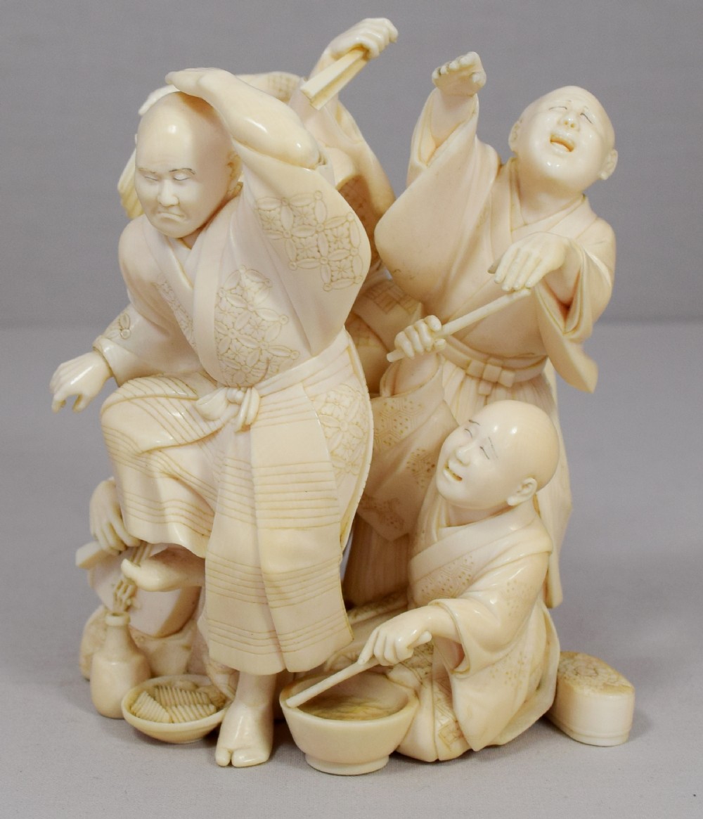 A WONDERFUL QUALITY JAPANESE IVORY OKIMONO MERRY DANCING GROUP View II