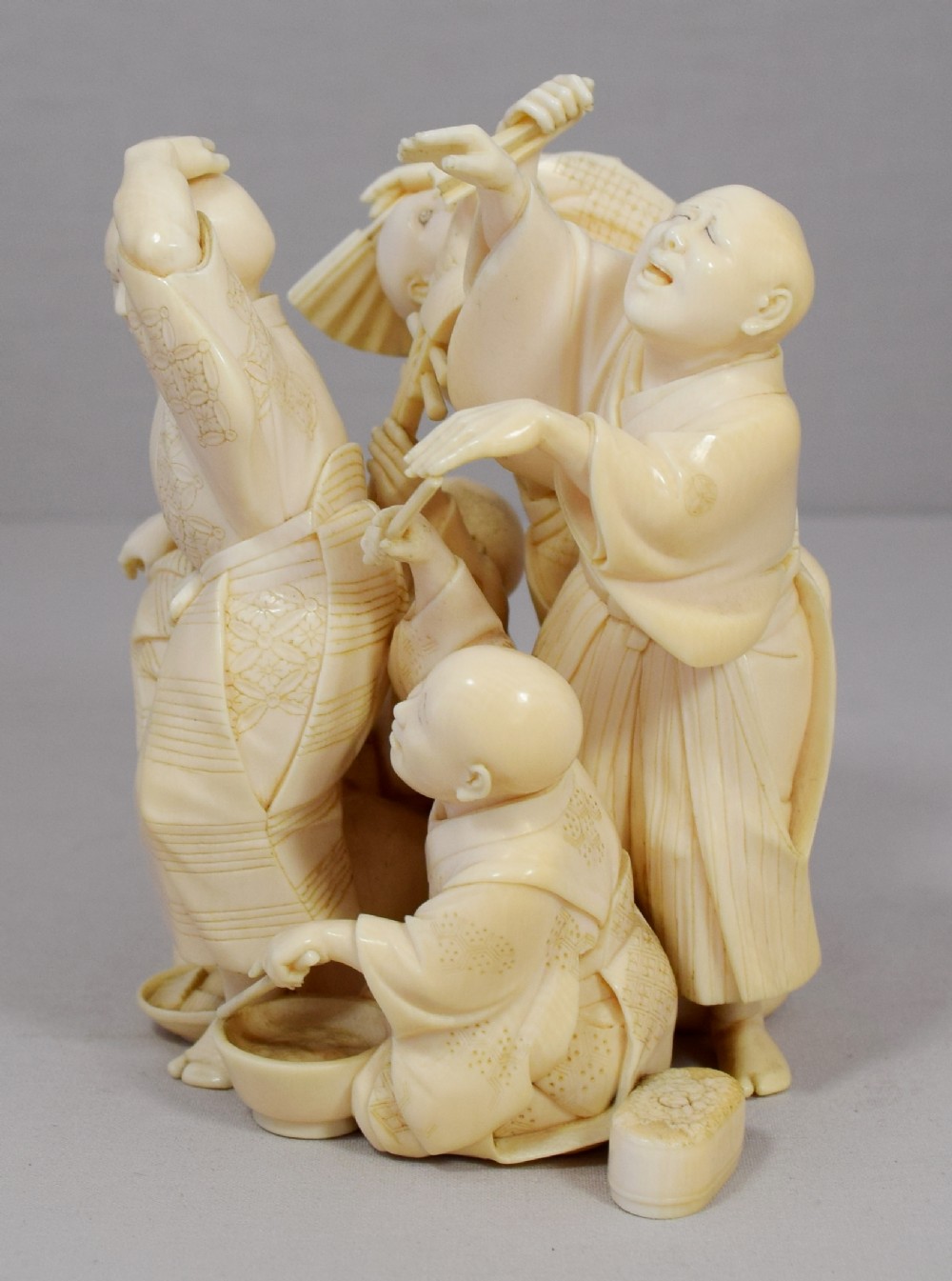 A WONDERFUL QUALITY JAPANESE IVORY OKIMONO MERRY DANCING GROUP View III