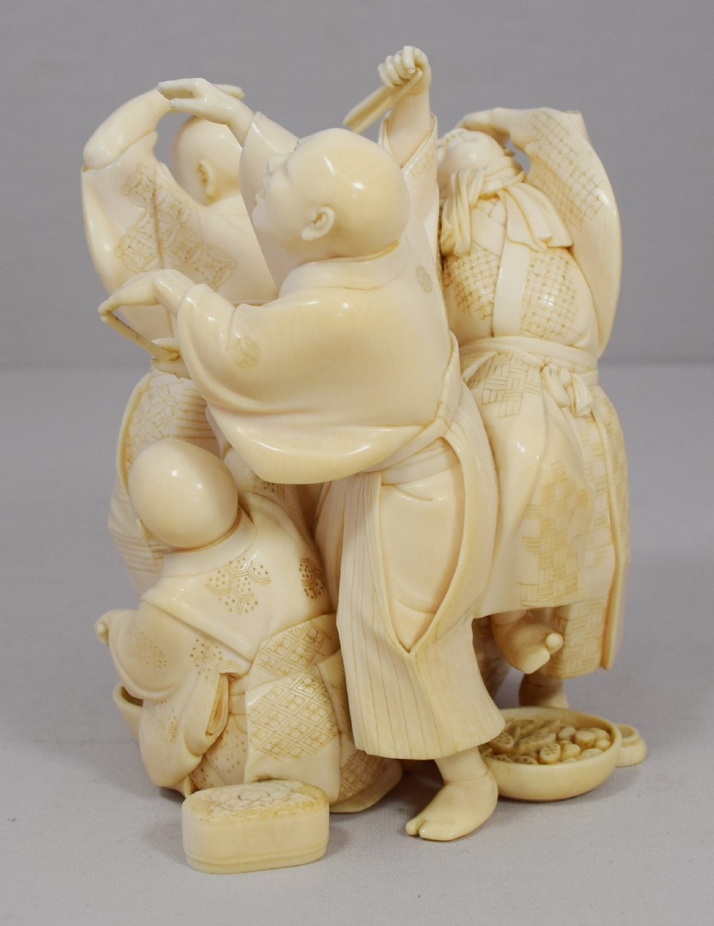 A WONDERFUL QUALITY JAPANESE IVORY OKIMONO MERRY DANCING GROUP View IV