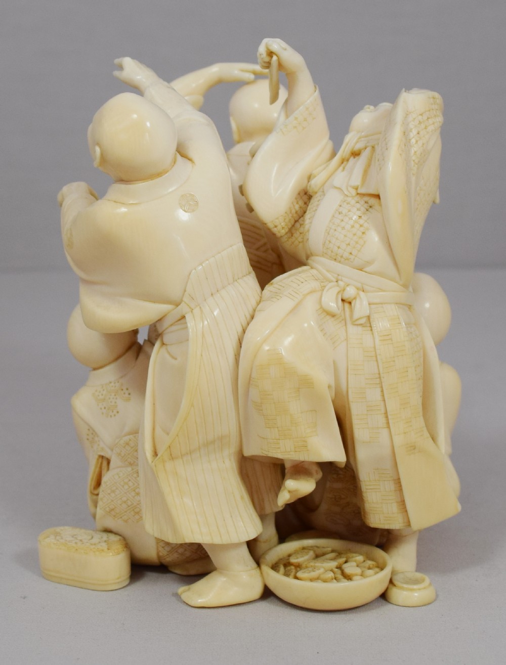 A WONDERFUL QUALITY JAPANESE IVORY OKIMONO MERRY DANCING GROUP View V