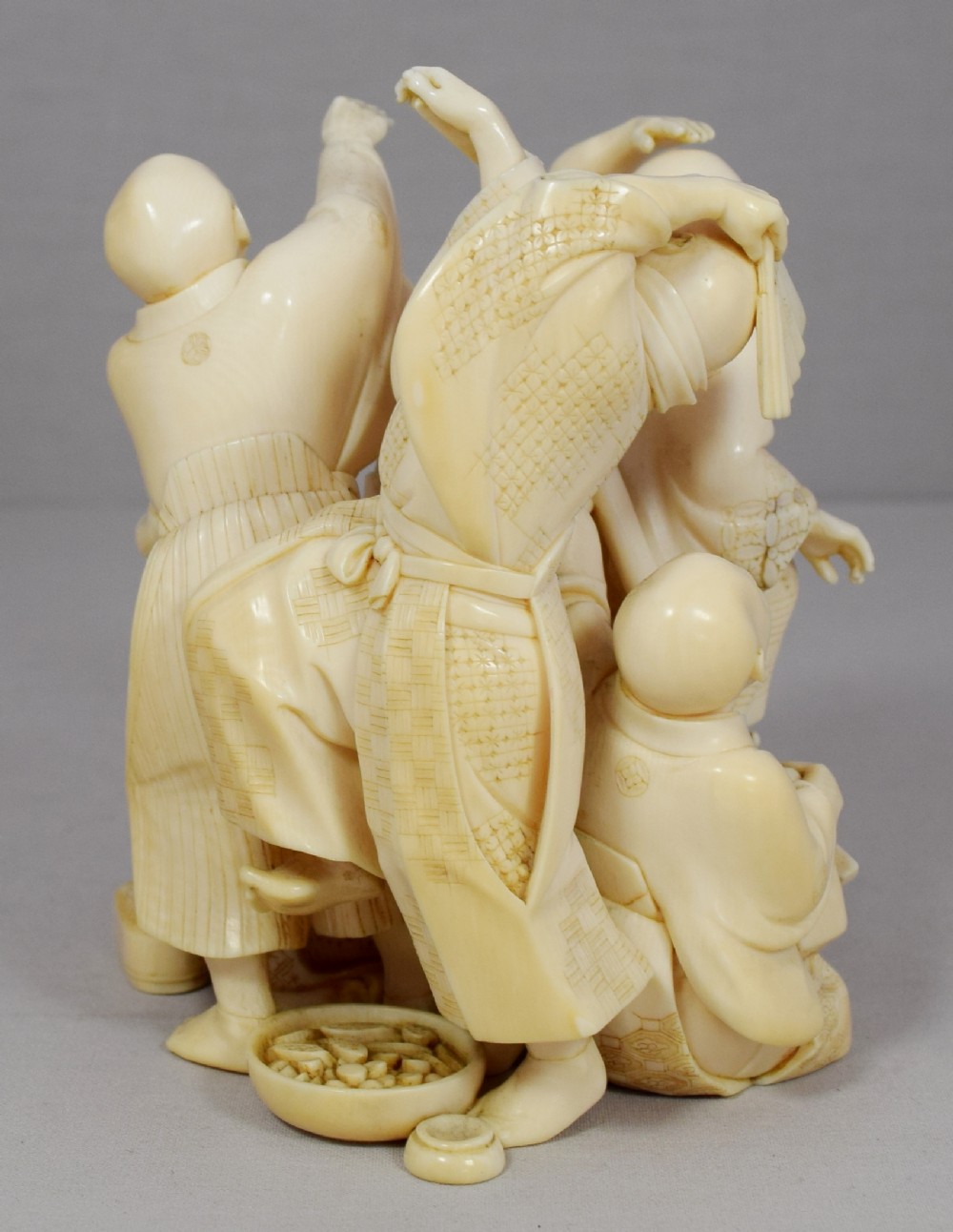 A WONDERFUL QUALITY JAPANESE IVORY OKIMONO MERRY DANCING GROUP View VI