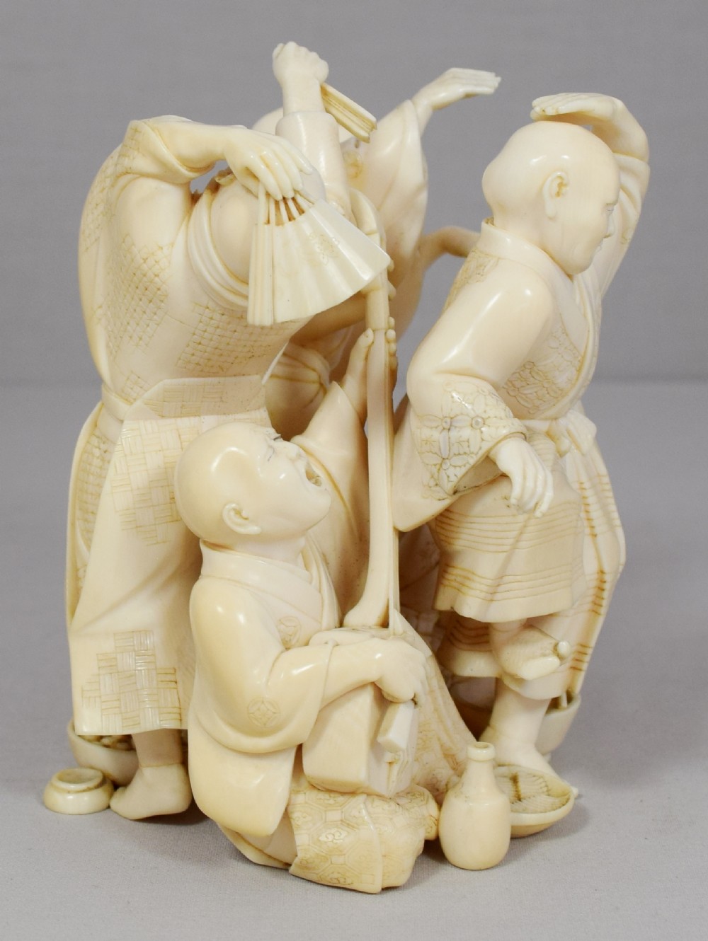 A WONDERFUL QUALITY JAPANESE IVORY OKIMONO MERRY DANCING GROUP View VII