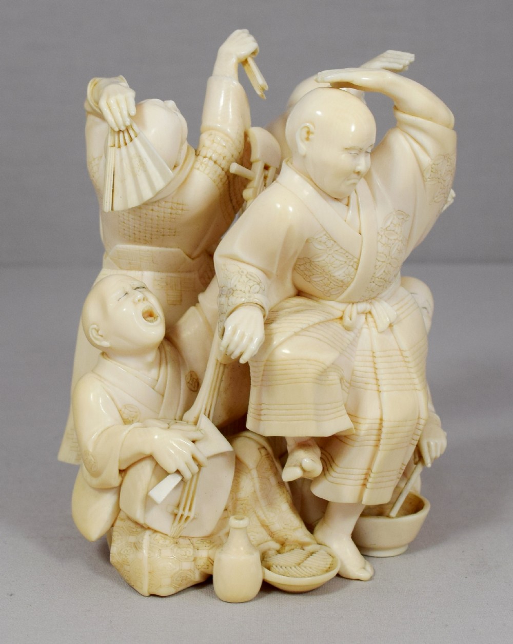 A WONDERFUL QUALITY JAPANESE IVORY OKIMONO MERRY DANCING GROUP View VIII