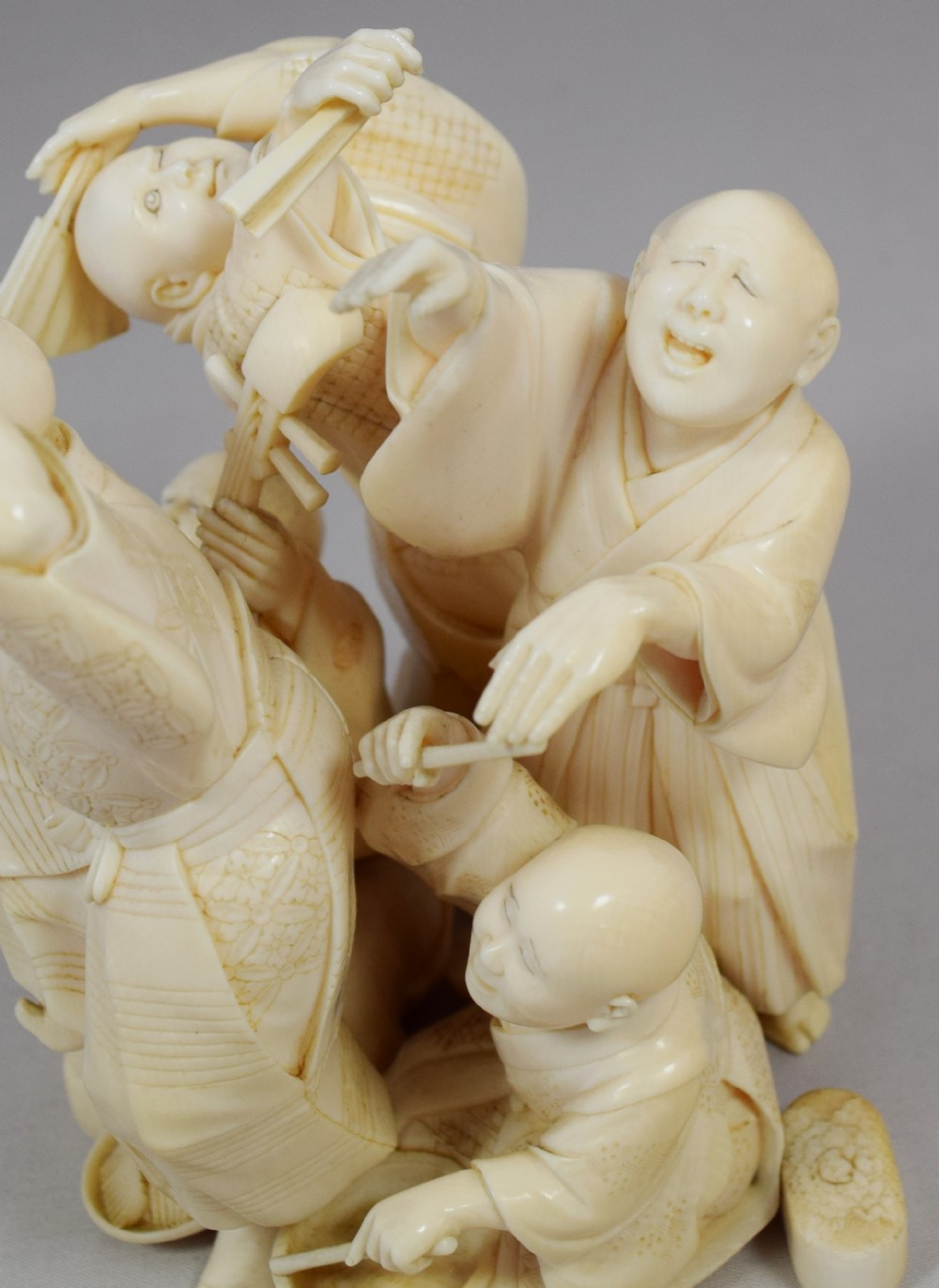 A WONDERFUL QUALITY JAPANESE IVORY OKIMONO MERRY DANCING GROUP View XI