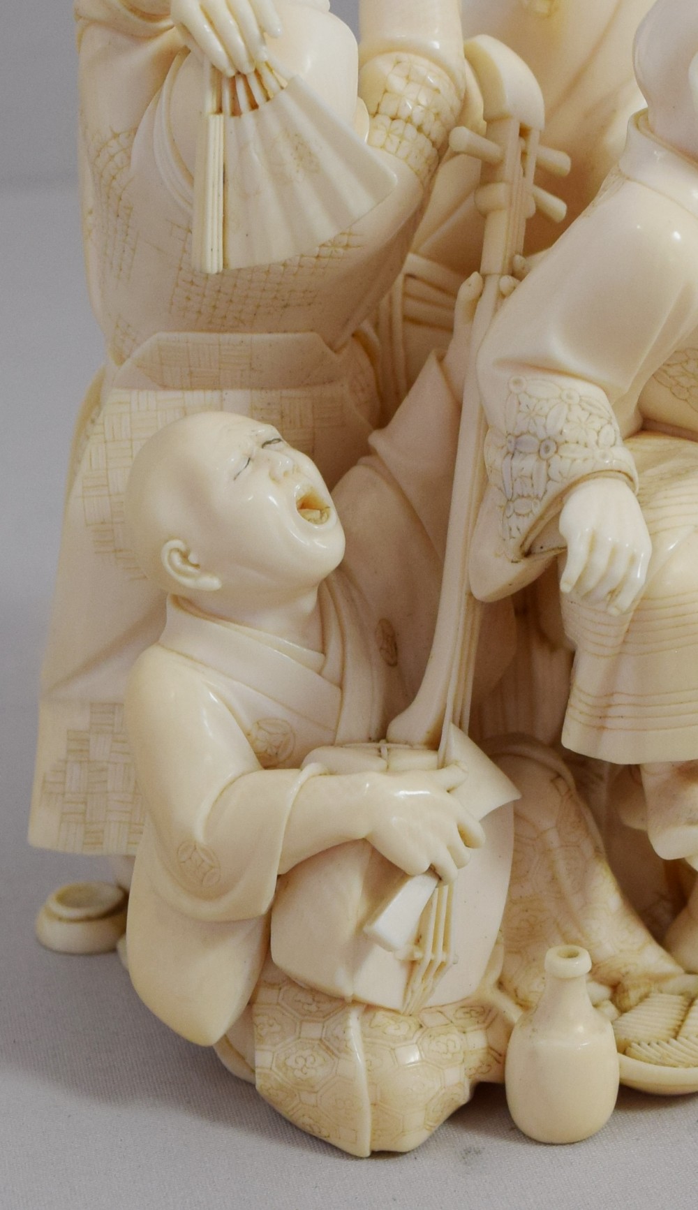 A WONDERFUL QUALITY JAPANESE IVORY OKIMONO MERRY DANCING GROUP View XIII