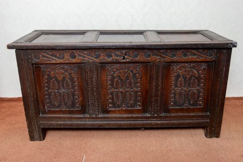 early oak coffer with original panelled top and wonderful carved panel front - CATEGORY: ANTIQUE CHESTS - DATED 17TH CENTURY