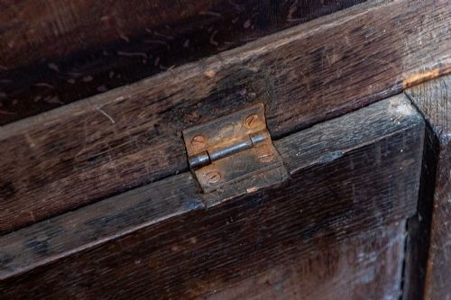 EARLY OAK COFFER WITH ORIGINAL PANELLED TOP AND WONDERFUL CARVED PANEL FRONT - ADDITIONAL PHOTO 3