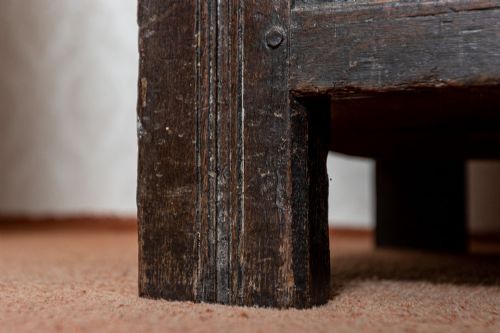 EARLY OAK COFFER WITH ORIGINAL PANELLED TOP AND WONDERFUL CARVED PANEL FRONT - ADDITIONAL PHOTO 9