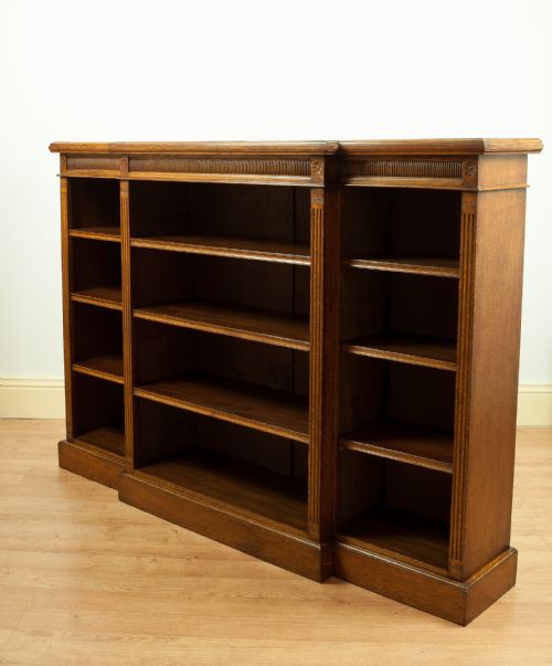 fig 2. A Victorian Oak Breakfront Open Bookcase, circa 1890.