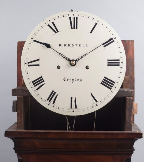 fig 2. A fine quality George III flame mahogany 8 day longcase/Grandfather clock by Handley & Moore of London, retailed by Restell of Croydon.