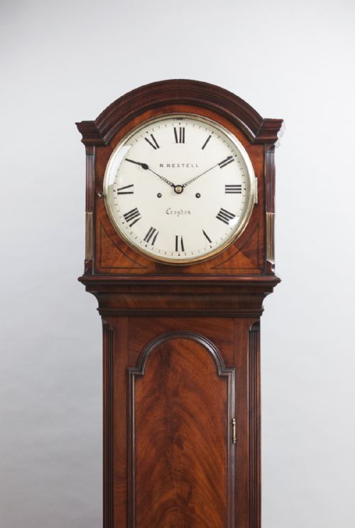fig 3. A fine quality George III flame mahogany 8 day longcase/Grandfather clock by Handley & Moore of London, retailed by Restell of Croydon.