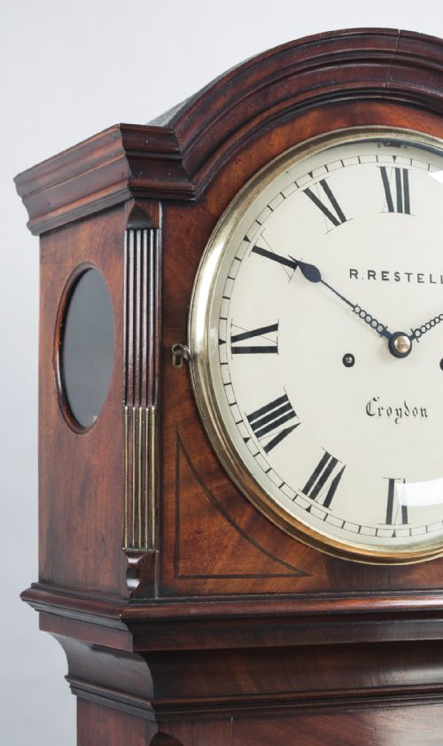 fig 4. A fine quality George III flame mahogany 8 day longcase/Grandfather clock by Handley & Moore of London, retailed by Restell of Croydon.