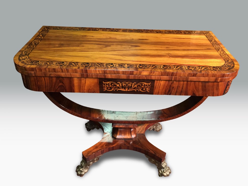 A SUPERB REGENCY GONCALO ALVES & HOLLY INLAID CARD TABLE IN THE MANNER OF GEORGE OAKLEY.