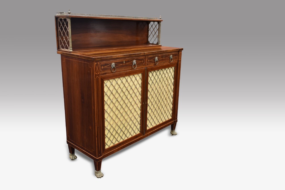 A Regency rosewood chiffonier featuring boxwood inlay, a top shelf with brass gallery and lattice sides, brass grille doors, lion mask handles, and a pull-out fitted writing drawer. View III