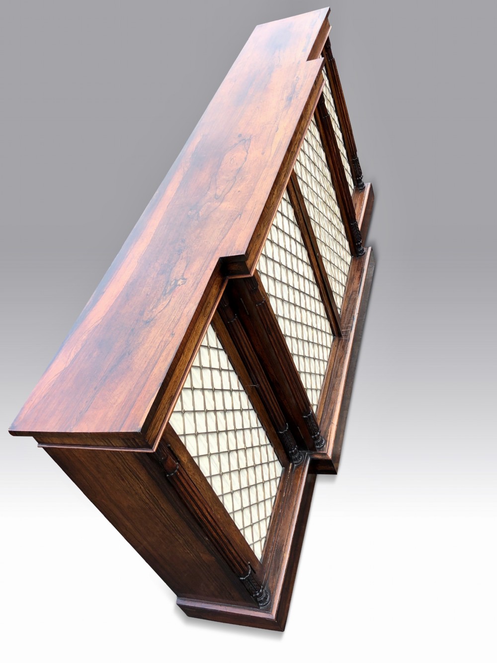 A MAGNIFICENT LATE REGENCY ROSEWOOD BREAKFRONT SIDE CABINET IN THE MANNER OF GILLOWS. View III
