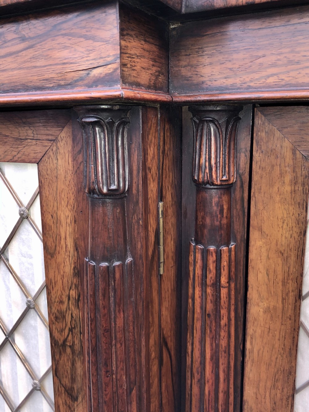 A MAGNIFICENT LATE REGENCY ROSEWOOD BREAKFRONT SIDE CABINET IN THE MANNER OF GILLOWS. View VI