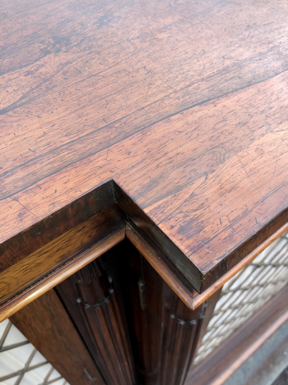 A MAGNIFICENT LATE REGENCY ROSEWOOD BREAKFRONT SIDE CABINET IN THE MANNER OF GILLOWS. View VIII