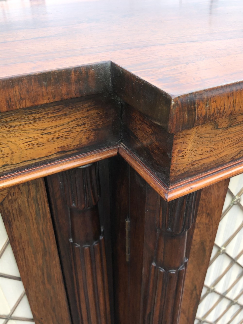 A MAGNIFICENT LATE REGENCY ROSEWOOD BREAKFRONT SIDE CABINET IN THE MANNER OF GILLOWS. View IX