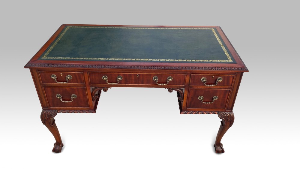 AN EDWARDIAN MAHOGANY KNEEHOLE DESK View II