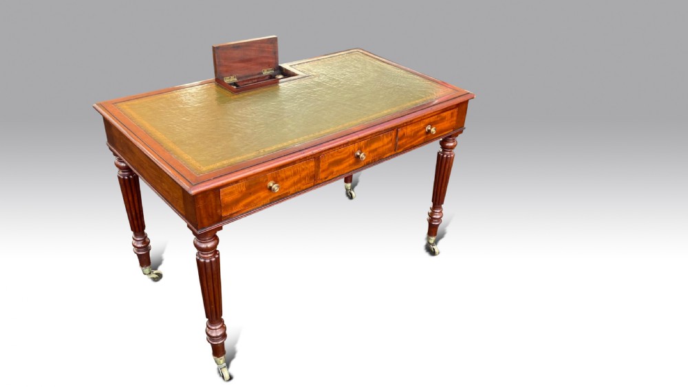 A REGENCY MAHOGANY CHAMBER WRITING TABLE BY GILLOWS