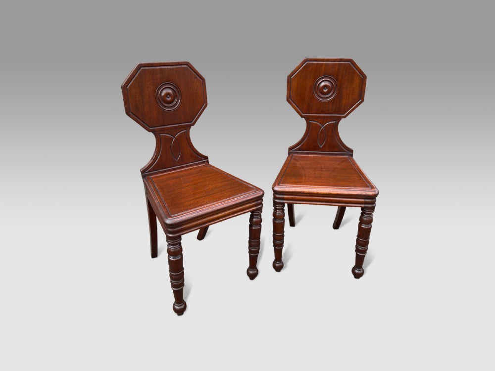 Pair of Regency mahogany hall chairs. View II