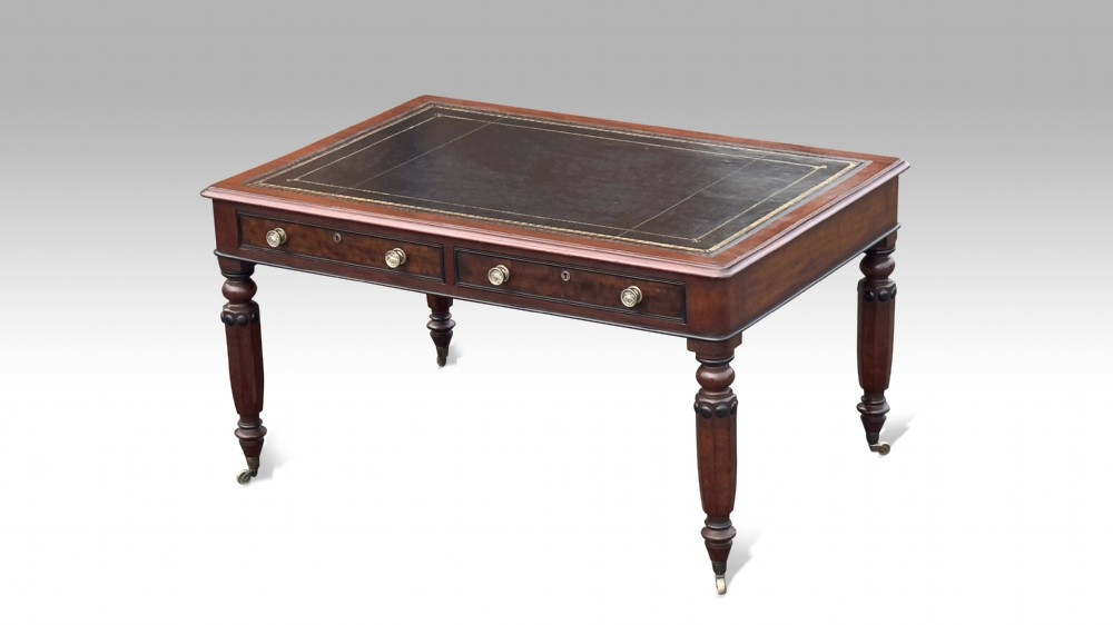 A Double sided Regency mahogany & ebonised partners library table.