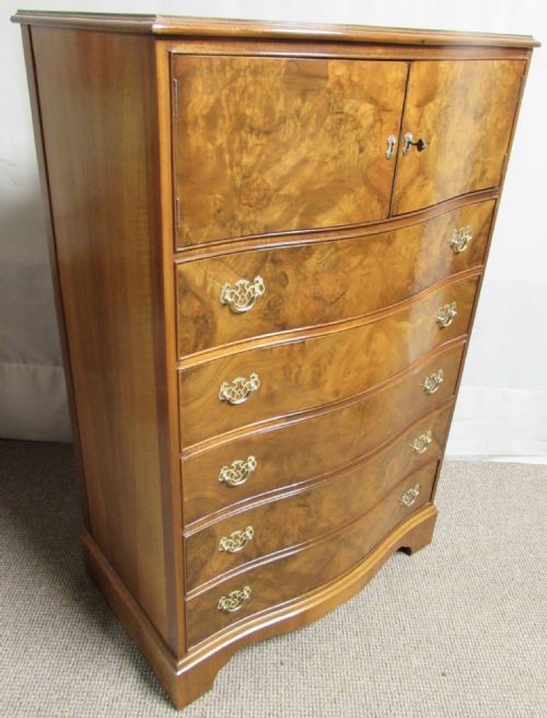 Burr Walnut Serpentine Chest of Drawers with Cupboard Over.