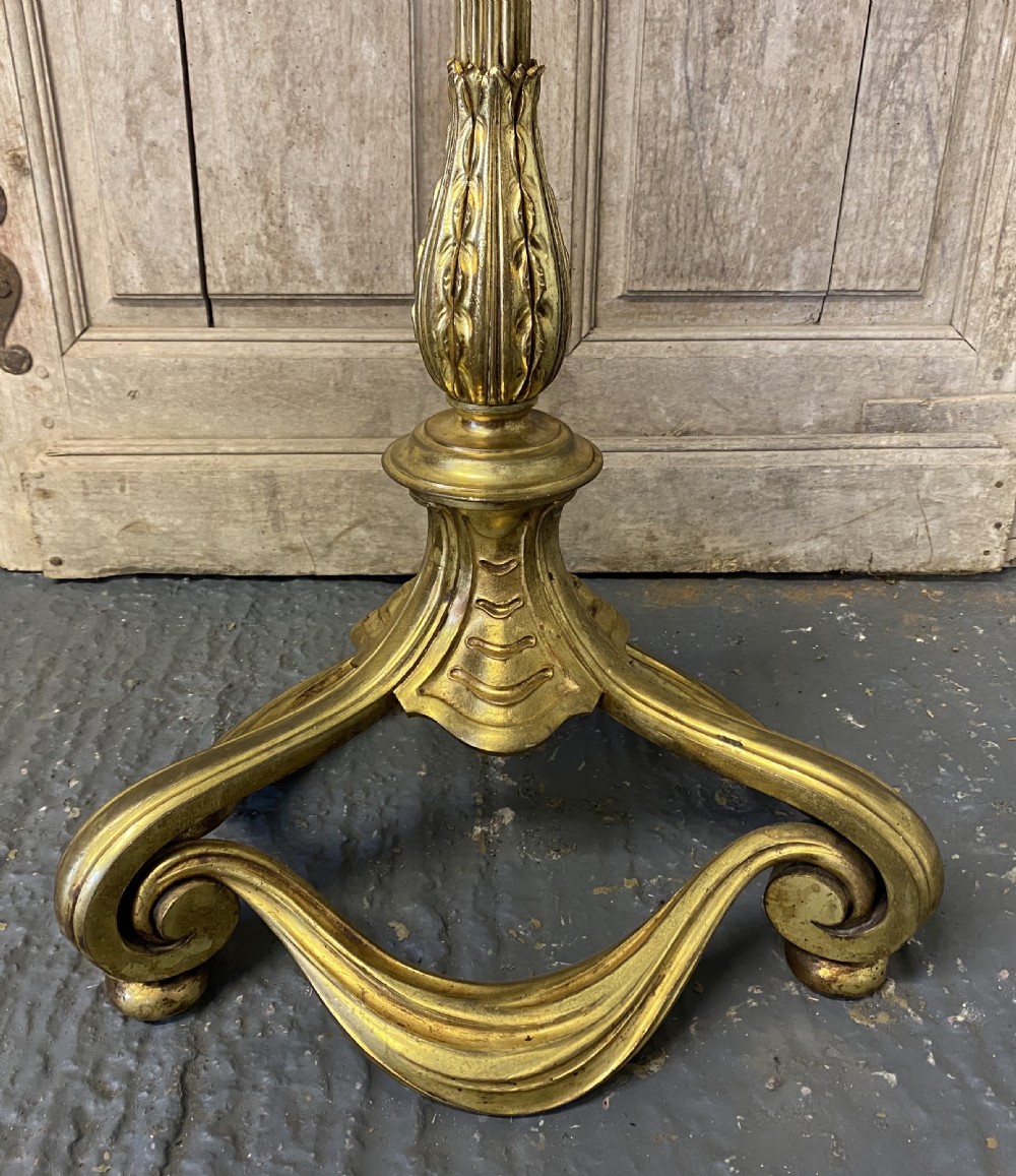 A French brass standard lamp featuring a fluted column shaft, scroll tripod base, and a white opal glass shade. View II