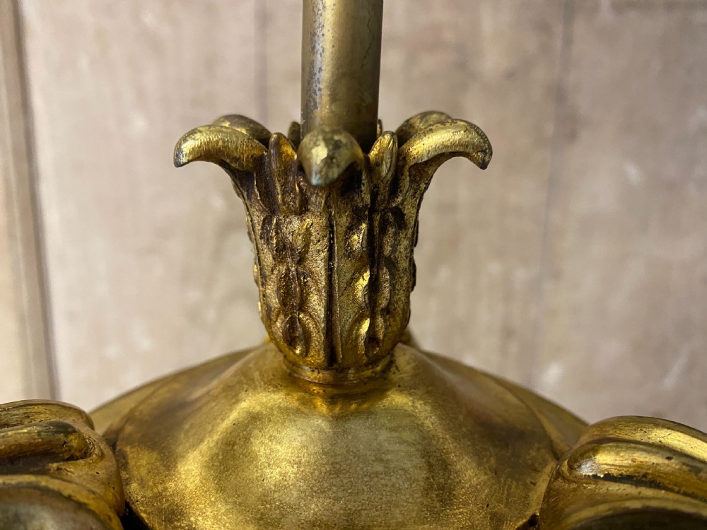 A French brass standard lamp featuring a fluted column shaft, scroll tripod base, and a white opal glass shade. View VII